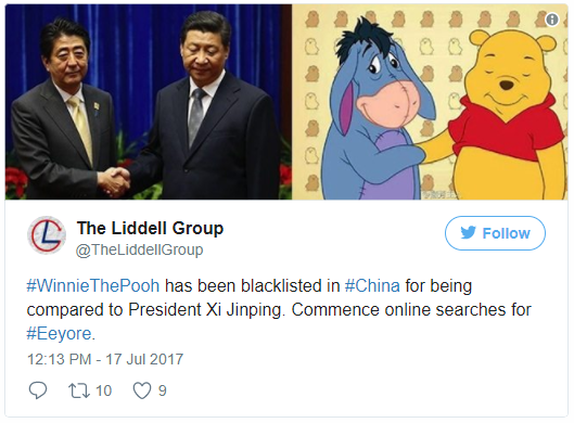 Chinese politicians side by side with Eeyore and Winnie the Pooh