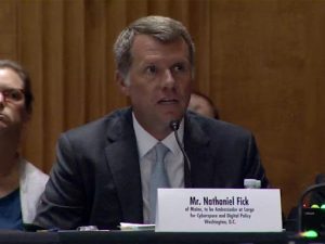 Photo shows identifier for Mr Nathaniel Fick of Maine, to be Ambassador at Large for Cyberspace and Digital Police, Washington, D.C. in front of Fick who is speaking into a microphone.